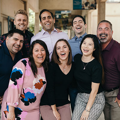 The MBA8 students sitting on amphitheatre steps